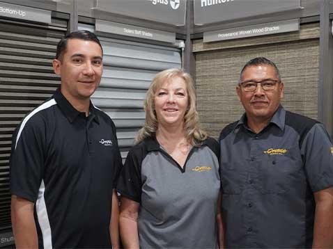 Company staff posing for a photo in the showroom